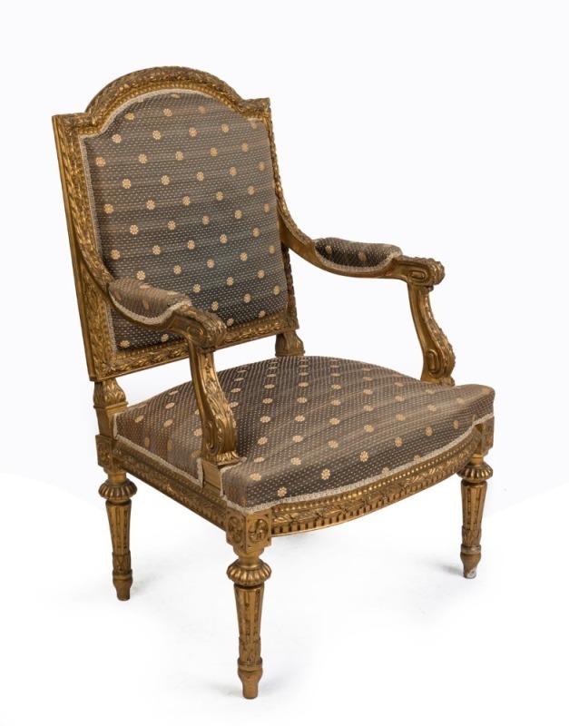 A French salon armchair with ornately carved gilt frame and brocade upholstery, 19th century, 64cm across the arms