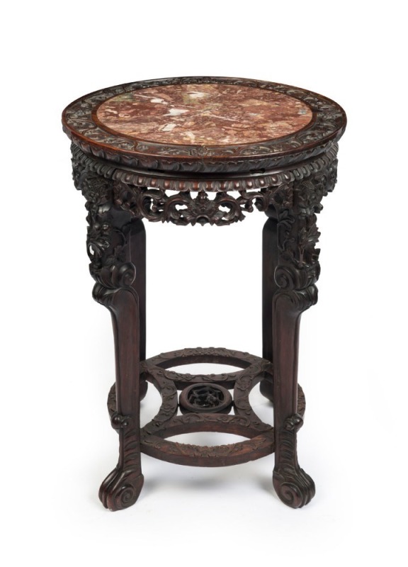 An antique Chinese rosewood table with carved decoration and rouge marble top, 19th century, 80cm high, 56cm diameter