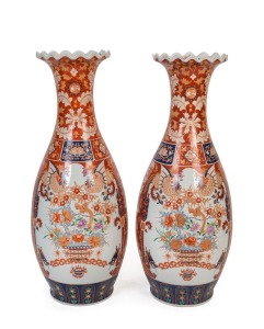 A pair of Chinese Imari porcelain monumental vases with frilled rims, on wooden stands, 20th century, 113cm high