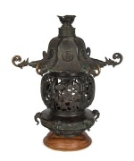 An antique Chinese cast bronze temple&nbsp;lantern, 18th century, later wooden plinth, 50cm high, 46cm wide