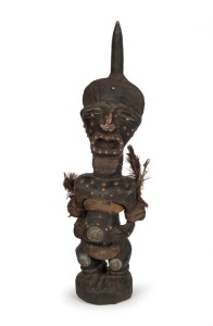 A fetish statue, carved wood and copper with cloth, feather, and fibre, West African origin, ​​​​​​​52cm high