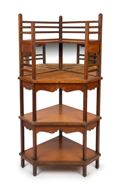 An antique English Aesthetic Movement walnut corner whatnot shelving stand with mirrored back, in the manner of EDWARD WILLIAM GODWIN 19th/20th century, 148cm high, 73cm wide, 52cm deep.