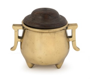 An antique Chinese bronze censer with turned wooden lid, 18th century or earlier, square seal mark to base, 14cm high overall, 15cm wide