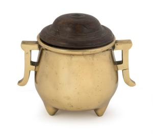 An antique Chinese bronze censer with turned wooden lid, 18th century or earlier, ​​​​​​​square seal mark to base, 14cm high overall, 15cm wide