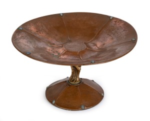 An Arts & Crafts compote, hand-beaten copper with brass figural stem, adorned with polished moonstones, possibly Austrian, last 19th century, artist monogram to base (illegible), ​​​​​​​20cm high, 35cm diameter