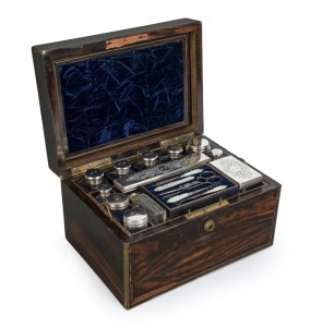 An antique English coromandel travel box fitted with silver plated bottles and mother of pearl vanity set, 19th century, 17cm high, 29cm wide, 21cm deep