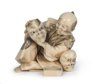 A Japanese carved marine ivory statue of the mask maker, 20th century, 6cm high