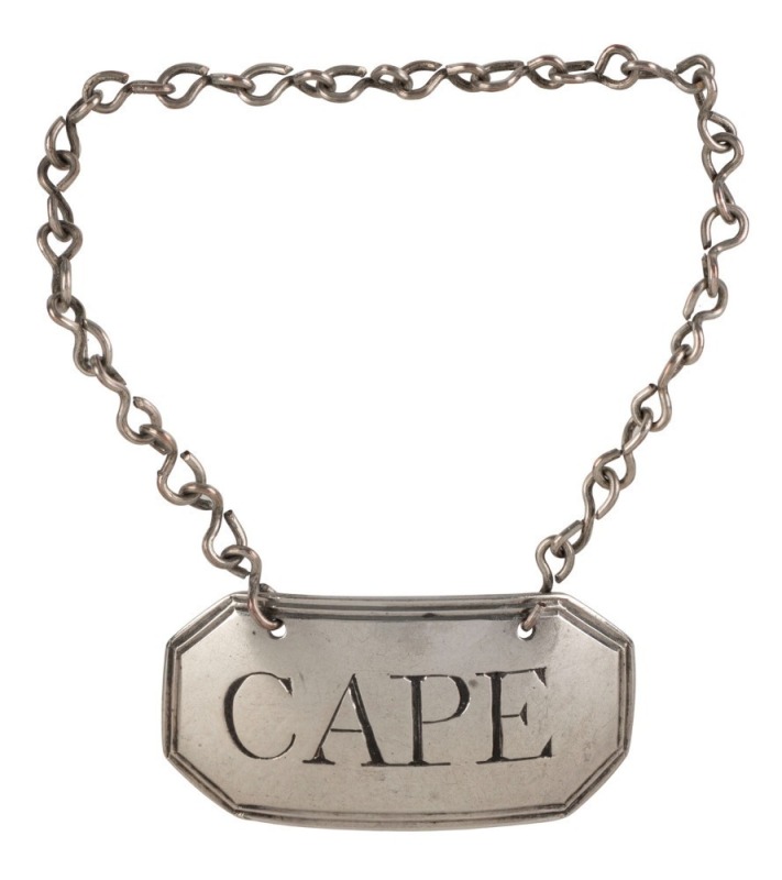 "CAPE" sterling silver Georgian decanter label by John Rich of London, circa 1795. Cape is a wine produced in the South African Cape province, and decanter labels bearing this name are extremely scarce indeed. 4cm wide