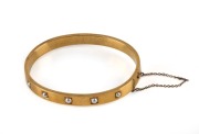 An elegant 18ct yellow gold bangle, set with five natural pearls, by the noted jewellers&nbsp;GODWIN of High Holborn, London, circa 1880s. Housed in original plush fitted box. Godwin traded from this address from 1791 to 1906. 6cm wide, 13.5 grams total - 2