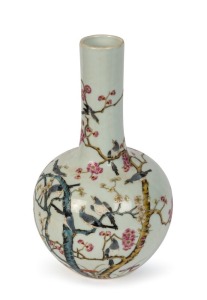 A Chinese bottle shaped porcelain vase decorated with magpies and blossoms, Republic period, 20th century, six character underglaze blue Qinglong mark. Note: A similar example sold at Zacke Auctions Vienna, Sept. 2022, lot 471. 21.5cm high.
