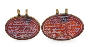 Two Ottoman Koranic pendants, mounted in gilt metal, 19th/20th century, ​​​​​​​5cm and 4.5cm wide