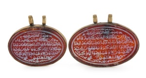 Two Ottoman Koranic pendants, mounted in gilt metal, 19th/20th century, 5cm and 4.5cm wide