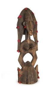 A Bambara guardian sculpture, carved wood with fabric tassels, Mali, Western Africa, 85cm high