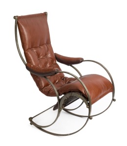 An early 20th century polished iron rocking chair in the manner of R.W. Winfield, decorative scroll frame with tan leather diamond button upholstery, stamped "T. Banks", circa 1900, 110cm high, 50cm across the arms