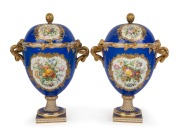 Coalbrookdale antique English porcelain pair of lidded table urns with royal blue ground, gilt decoration and hand-painted vignettes, signed to the base, 19th century, 32cm high 