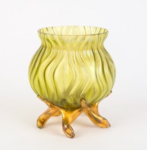 An antique iridescent green glass vase with gilt finished legs, late 19th century, 14cm high