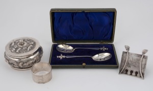 A pair of boxed spoons, silver plated novelty wishbone napkin holder, sterling silver napkin ring and an Indian silver box, 19th and 20th century, ​​​​​​​the Indian box 9cm wide