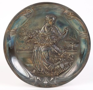 An antique silver plated embossed plaque, 19th century, 30cm diameter
