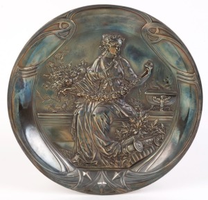 An antique silver plated embossed plaque, 19th century, ​​​​​​​30cm diameter