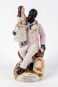 "UNCLE TOM & EVA" Staffordshire pottery statue, circa 1850s, 21cm high