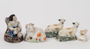 "BOY WITH SORE FOOT" Staffordshire pottery statue together with four assorted Staffordshire pottery sheep statues, 19th century, the boy 7cm high