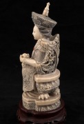 A pair of Chinese carved ivory ancestor statues on carved wooden stands, early to mid 20th century, ​​​​​​​18cm high overall - 10