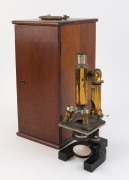 An antique brass microscope in original fitted mahogany case, 19th century, the case 37cm high