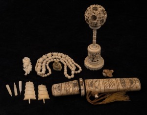 An antique Chinese carved ivory puzzle ball, ivory necklace and brooch, bone paper knife, etc, 19th and 20th century, the puzzle ball 16.5cm high