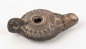 A Roman pottery oil lamp, 2nd century A.D. 10.5cm long