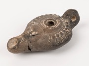 A Roman pottery oil lamp, 2nd century A.D. ​​​​​​​10.5cm long - 2