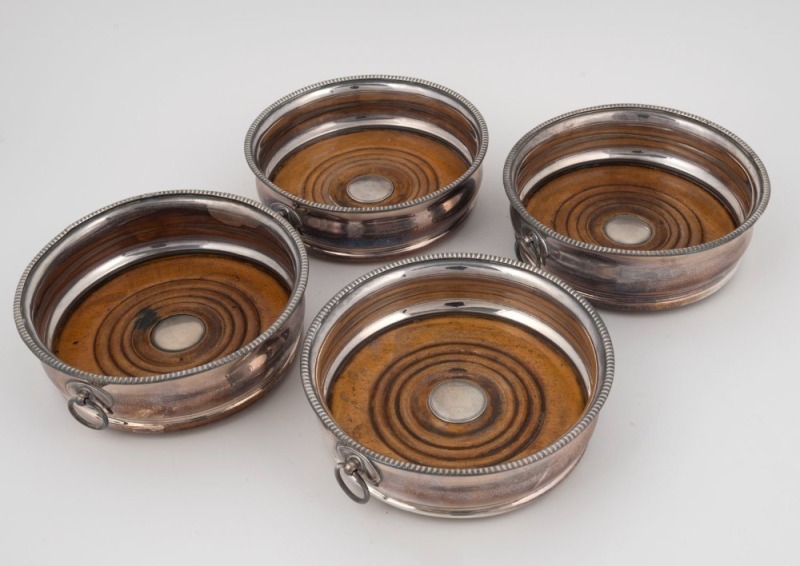 Set of four antique silver plated wine bottle coasters, 19th century, ​​​​​​​5cm high, 14.5cm diameter