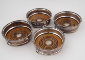 Set of four antique silver plated wine bottle coasters, 19th century, 5cm high, 14.5cm diameter