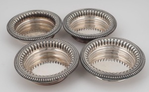 Set of four silver plated wine bottle coasters, 20th century, 4.5cm high, 17cm diameter