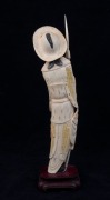 A Chinese carved ivory statue of a standing warrior&nbsp;wearing a hat, on wooden stand, early to mid 20th century, 27.5cm high overall - 3