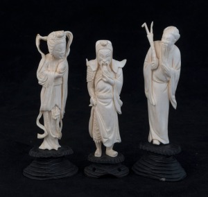 Three Chinese carved ivory statues of a standing figure, early to mid 20th century, the largest 15cm high overall