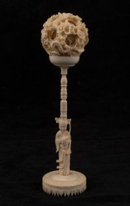 A Chinese carved ivory puzzle ball, early to mid 20th century, 20.5cm high overall