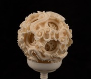 A Chinese carved ivory puzzle ball, early to mid 20th century, 20.5cm high overall - 2
