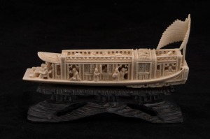 A Chinese carved ivory barge, on wooden stand, early to mid 20th century, 18m long overall