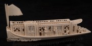 A Chinese carved ivory barge, on wooden stand, early to mid 20th century, 18m long overall - 2