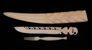 A marine ivory paperknife, a carved ivory paperknife and a fork, 19th/20th century, (3 items), the largest 25cm long