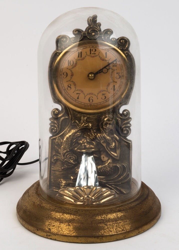 An American electric novelty mantel clock with automated water font