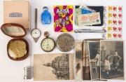 Assorted antique postcards, stamps, calling cards, pocket watch, travel clock, opium bottle, "Cycle Cup", Chinese furniture lock, ABBA Scanlens cards, pressure gauge and map measuring instrument, (15 items),