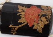 A fine Japanese black lacquered inro&nbsp;with decorative metal&nbsp;ojime&nbsp;and red lacquered netsuke, Meiji period, the inro&nbsp;8.5cm high - 5