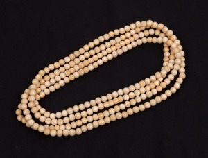 An antique ivory bead necklace, 19th/20th century, ​​​​​​​150cm long