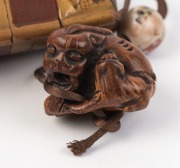 An antique Japanese inro, lacquered cherry wood with gilded landscape scene, with ceramic ojime&nbsp;and Foo dog carved boxwood netsuke, Meiji period, ​​​​​​​the inro 9cm high - 6