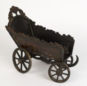 A Dutch folk art carved wood and iron toy cart, beautifully painted with ship portrait of the ZEEHOND (Sea Hound), dated 1781 and town scenes on the sides, 18th century, 30cm high, 39cm long, 18cm wide - 2