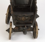 A Dutch folk art carved wood and iron toy cart, beautifully painted with ship portrait of the ZEEHOND (Sea Hound), dated 1781 and town scenes on the sides, 18th century, 30cm high, 39cm long, 18cm wide - 3