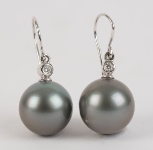 A pair of South Seas pearl (12mm) and diamond earrings set in silver