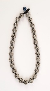 Chinese silver bead necklace, threaded on black silk knotted cord with glass bead clasp, ​​​​​​​48cm long