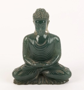 A carved jade seated Buddha statute, 20th century, ​​​​​​​9.5cm high